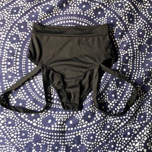 High rise bottoms with attached leg harness.